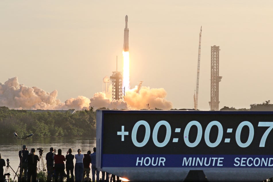 Members of the media gather to capture the moment a SpaceX Falcon Heavy rocket lifts off from Launch Complex 39A carrying NASA’s Nancy Grace Roman Space Telescope at Kennedy Space Center in Cape Canaveral, Florida, on August 30, 2026.