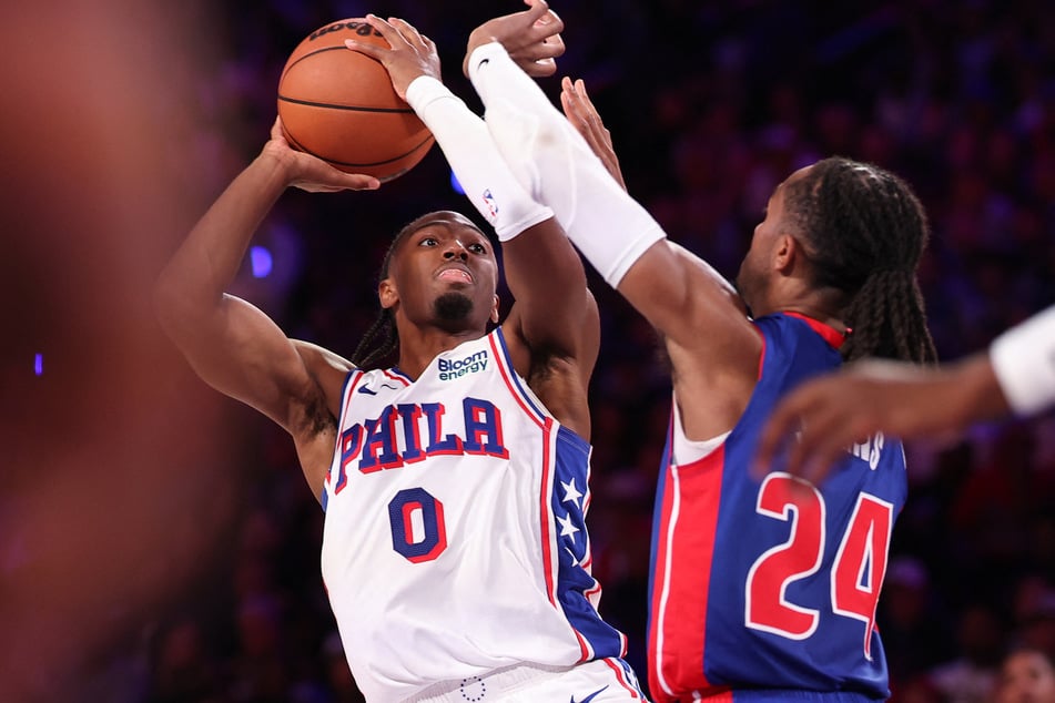 Philadelphia 76ers guard Tyrese Maxey shoots in front of Detroit Pistons guard Daniss Jenkins during the fourth quarter at Xfinity Mobile Arena.