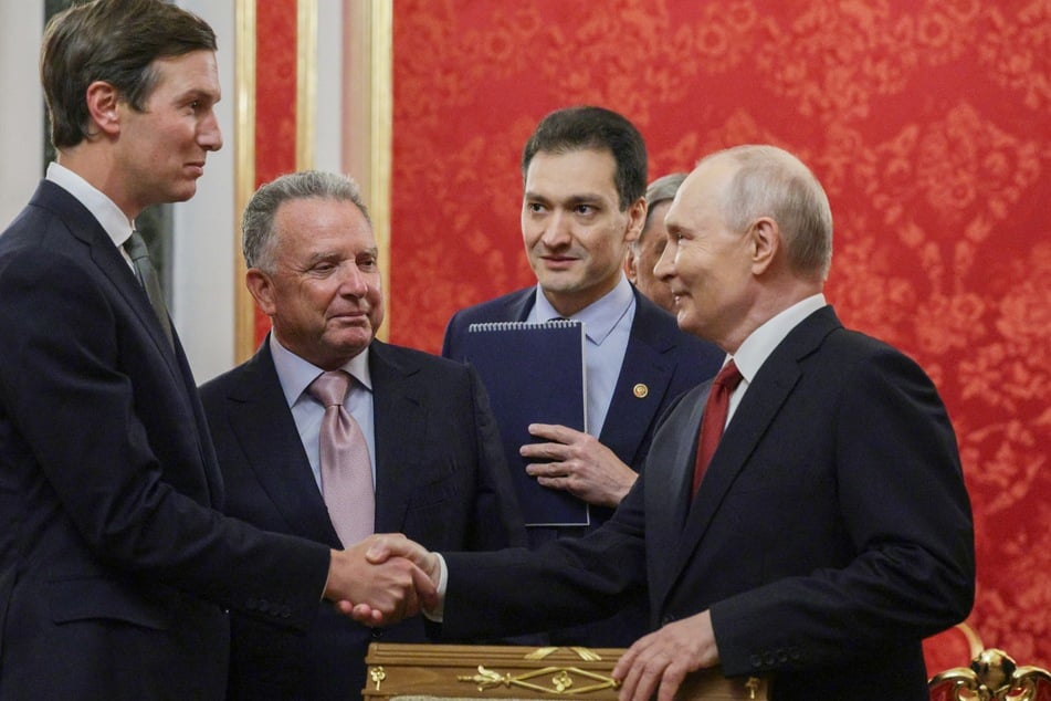 Russian President Vladimir Putin (r.) greets US envoys Steve Witkoff (center l.) and President Donald Trump's son-in-law Jared Kushner (l.) in Moscow, Russia, on September 5, 2026. Putin praised Trump while addressing the envoys in a grand Kremlin hall.