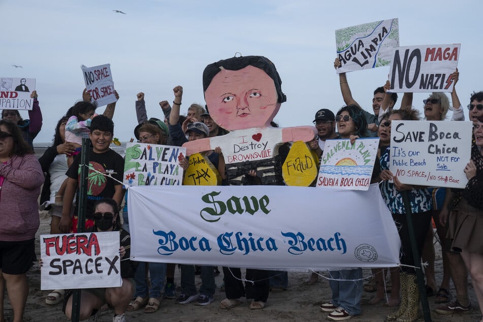 People protest against Elon Musk incorporating the Boca Chica Village neighborhood, where the SpaceX facilities are located, becoming its own municipality, in Brownsville, Texas, on May 3, 2025.