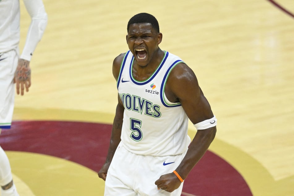 The Minnesota Timberwolves' Anthony Edwards celebrates in the fourth quarter against the Cleveland Cavaliers at Rocket Arena on October 26, 2026. The guard will reportedly be out for around two months as he undergoes arthroscopic right knee surgery.