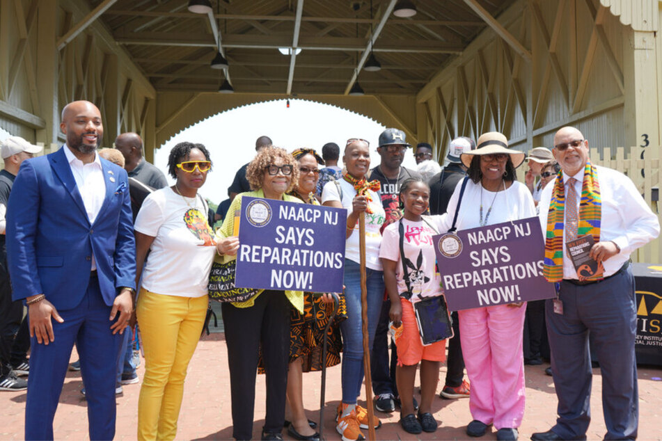 Racial justice advocates celebrate the official launch of the New Jersey Reparations Council in Perth Amboy on June 19, 2023.