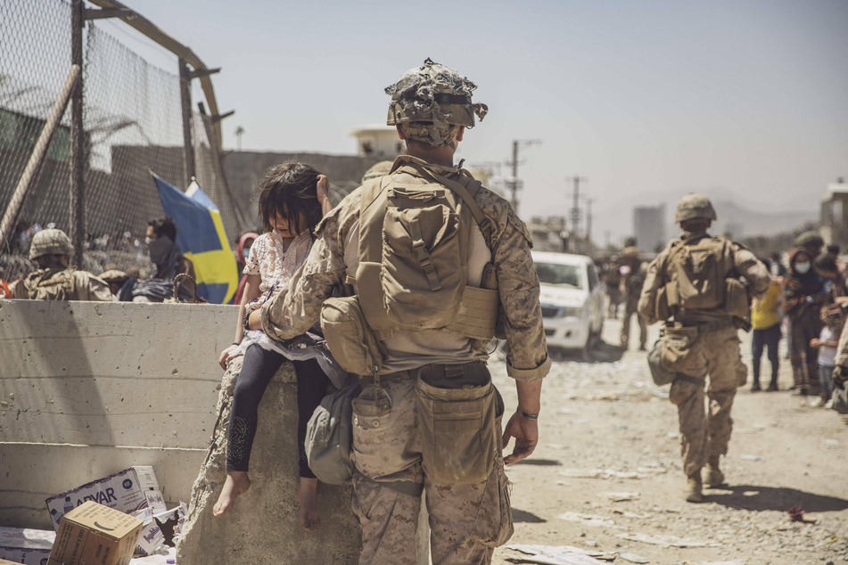 US service members remain at the Kabul airport to assist with evacuation efforts despite Thursday's deadly terrorist attack.