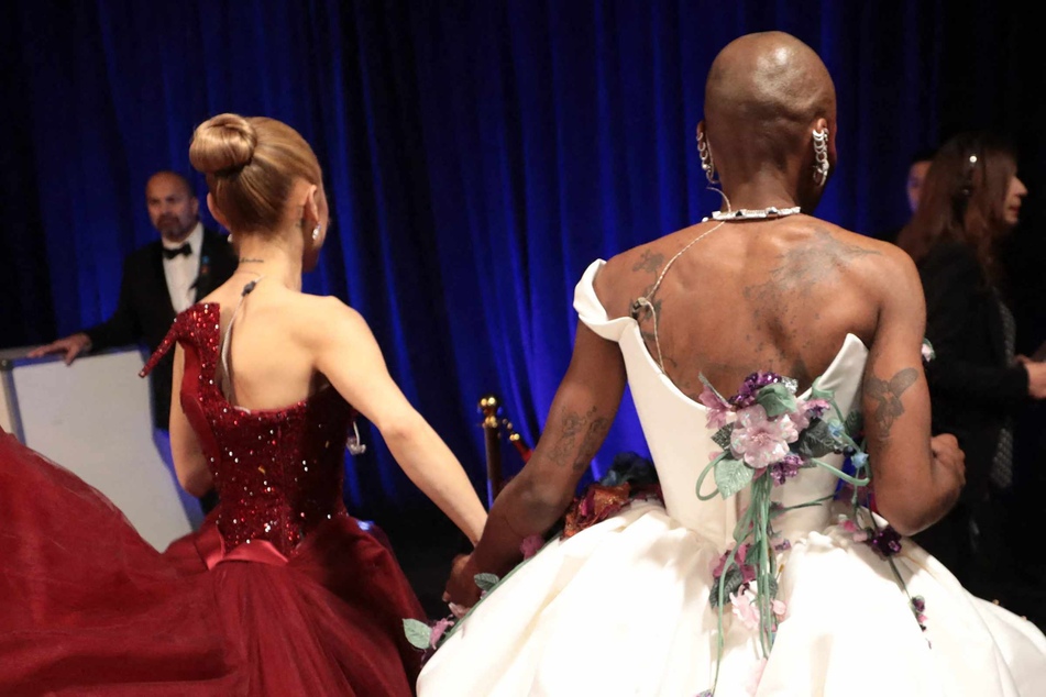 In this handout photo provided by The Academy, Ariana Grande (l.) and Cynthia Erivo (r.) are seen backstage during the 97th Annual Oscars at Dolby Theatre on Sunday in Hollywood, California.