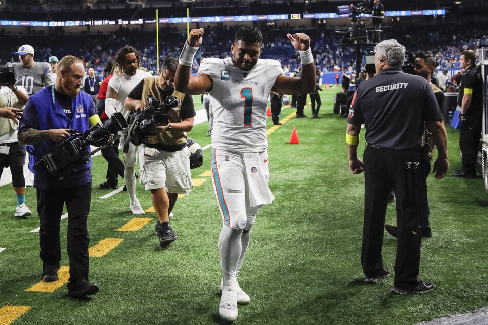Tua Tagovailoa celebrates after the Miami Dolphins' win over the Detroit Lions.
