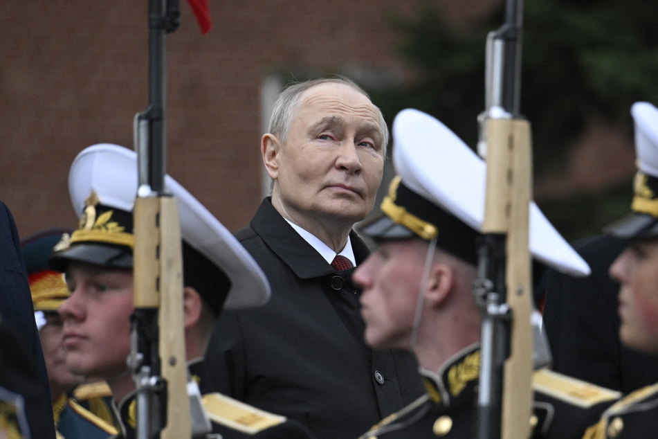 Russian President Vladimir Putin attends a ceremony to lay flowers at the Tomb of the Unknown Soldier by the Kremlin wall in central Moscow on May 9, 2026.