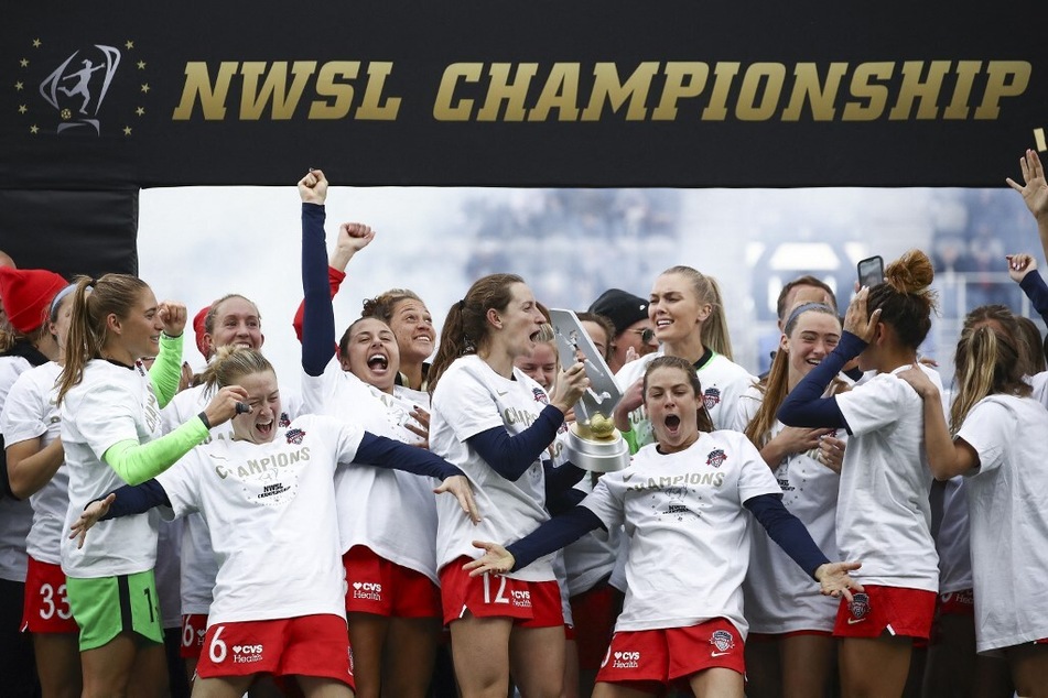 The Washington Spirit celebrate after defeating Chicago Red Stars during the NWSL Championship held at Lynn Family Stadium on November 20, 2021, in Louisville, Kentucky.