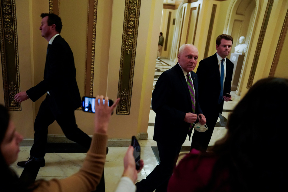 House Majority Leader Steve Scalise (c.) returned from cancer treatment to swing the impeachment vote 214-213 in favor of Republicans.
