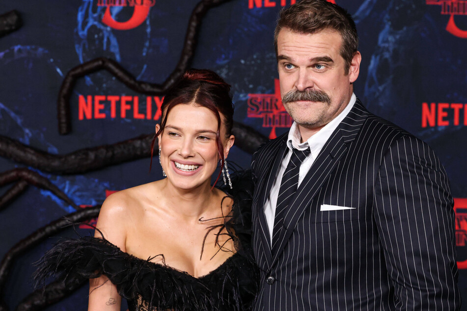 Millie Bobby Brown (l.) and David Harbour have made it clear that they're on good terms after the alleged harassment complaint.