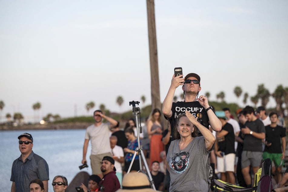 People gather near SpaceX’s Starbase facility to watch the launch of Starship Flight 14. With the launch, Elon Musk's company hopes to kick off an "exciting new phase" of development.