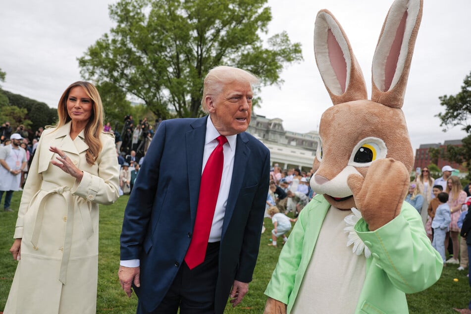 President Donald Trump (c.), first lady Melania Trump (l.), and the Easter Bunny (r.) greet guests during the White House Egg Roll on the South Lawn on Monday in Washington, DC.