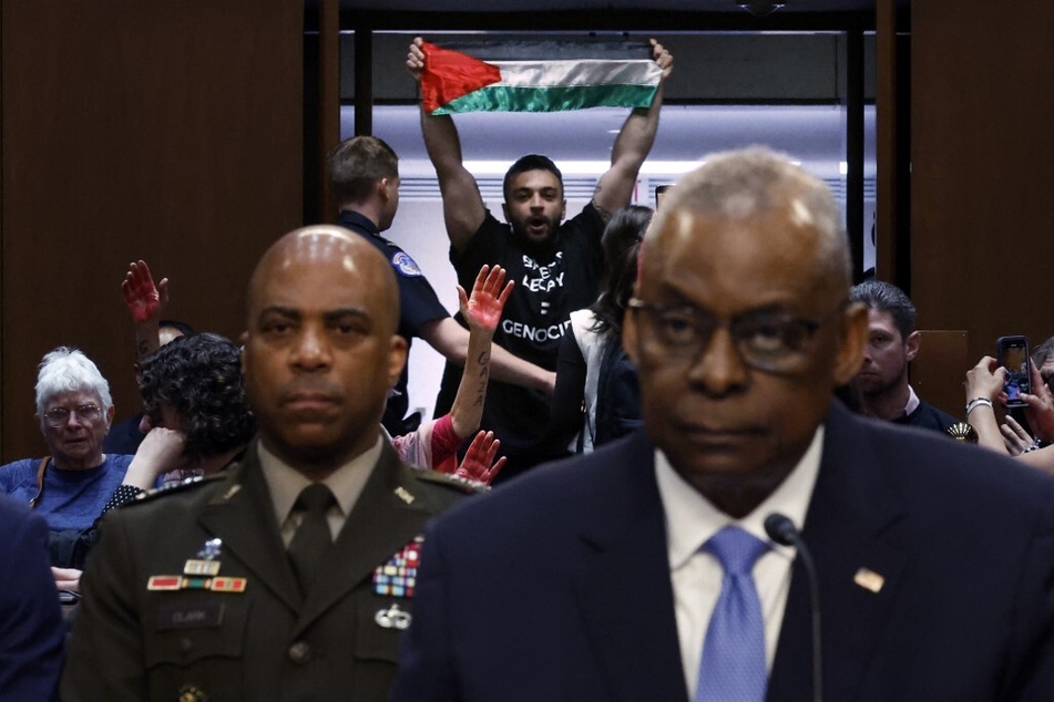 Lloyd Austin denies Gaza genocide in Senate hearing as activists speak out: "Shame on you!"