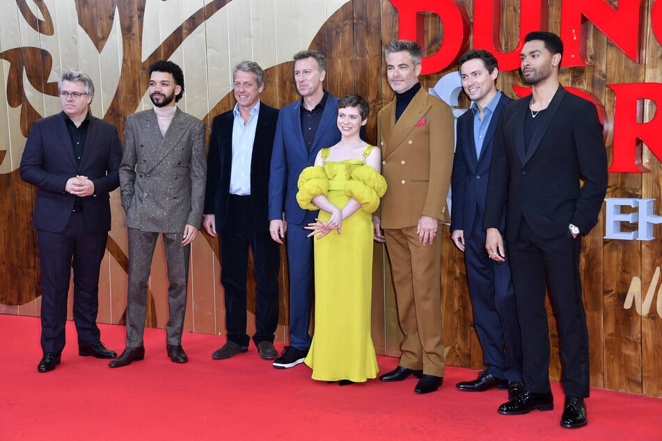 (From l to r) Jeremy Latcham, Justice Smith, Hugh Grant, Jonathan Goldstein, Sophia Lillis, Chris Pine, John Francis Daley, and Regé-Jean Page attend the premiere of Dungeons & Dragons: Honor Among Thieves in Berlin.