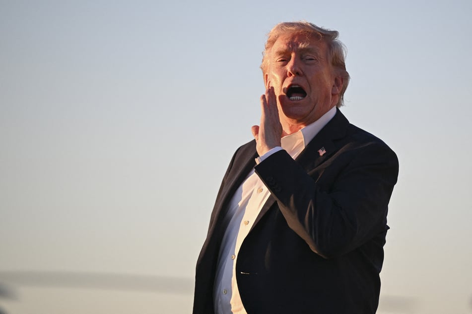 President Donald Trump disembarks from Air Force One upon arrival at Joint Base Andrews on May 3, 2026.