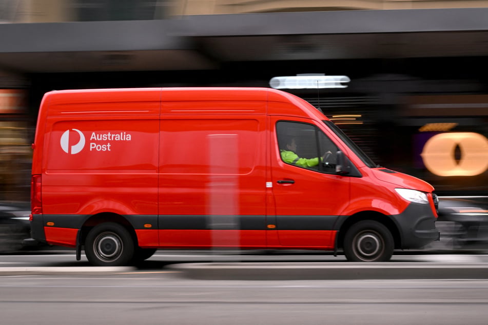 An Australia Post van drives through the central business district in Melbourne on August 26, 2025.
