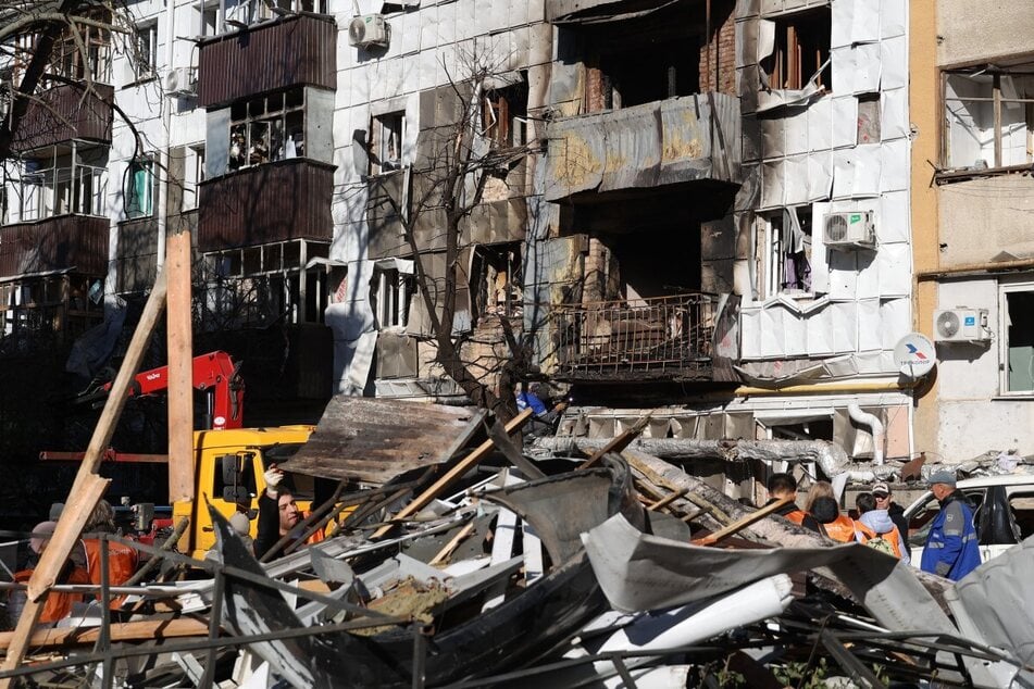 Debris is seen near a damaged residential area following an overnight drone attack on Belgorod on October 25, 2026. Russia claims Ukraine carried out a "massive drone attack" overnight.