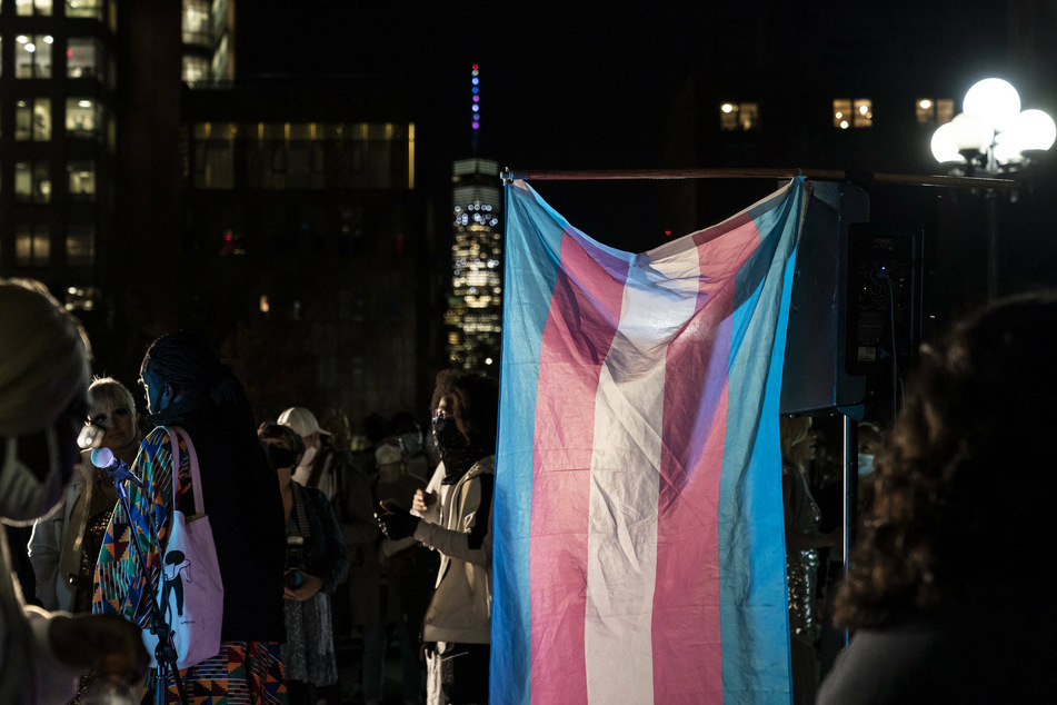 NYC activist confronts two women posting transphobic stickers