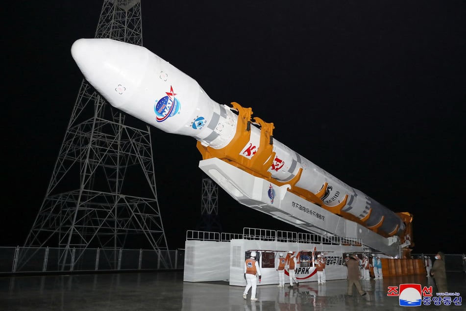 A rocket carrying a spy satellite Malligyong-1 is prepared to be launched in North Korea in this handout picture obtained on November 21, 2023.