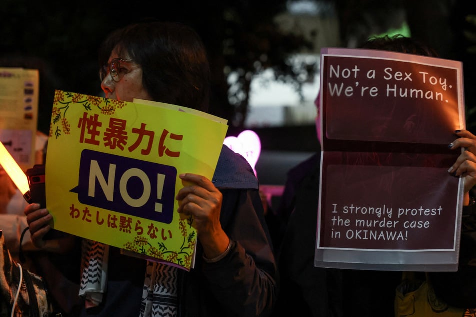 Demonstrators protest outside the Prime Minister's office following the killing of a Japanese woman in Okinawa on Monday. The murder has spiked tensions over the presence of the US military in Japan.
