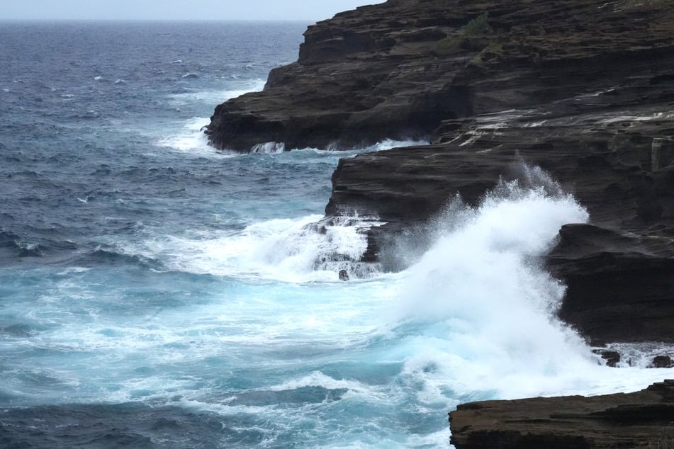 Hurricane Lowell lashed Hawaii with damaging winds, rainfall, and floods on Tuesday. The Category 2 storm has led to widespread power outages.