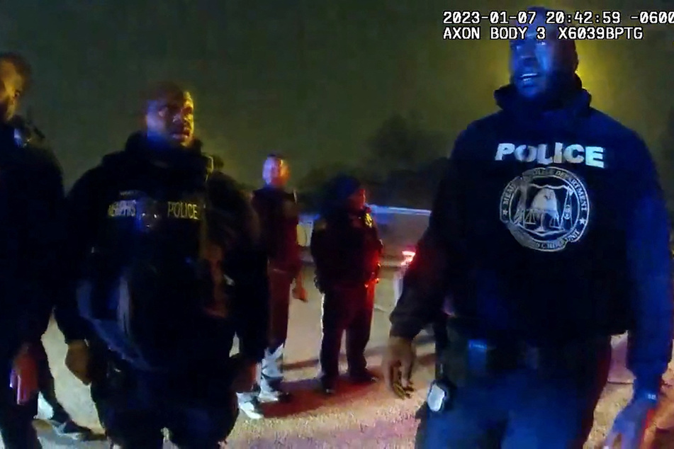 Memphis Police Department officers stand near Tyre Nichols, a 29-year-old Black man who was pulled over while driving, beaten, and died three days later, on January 7, 2023.