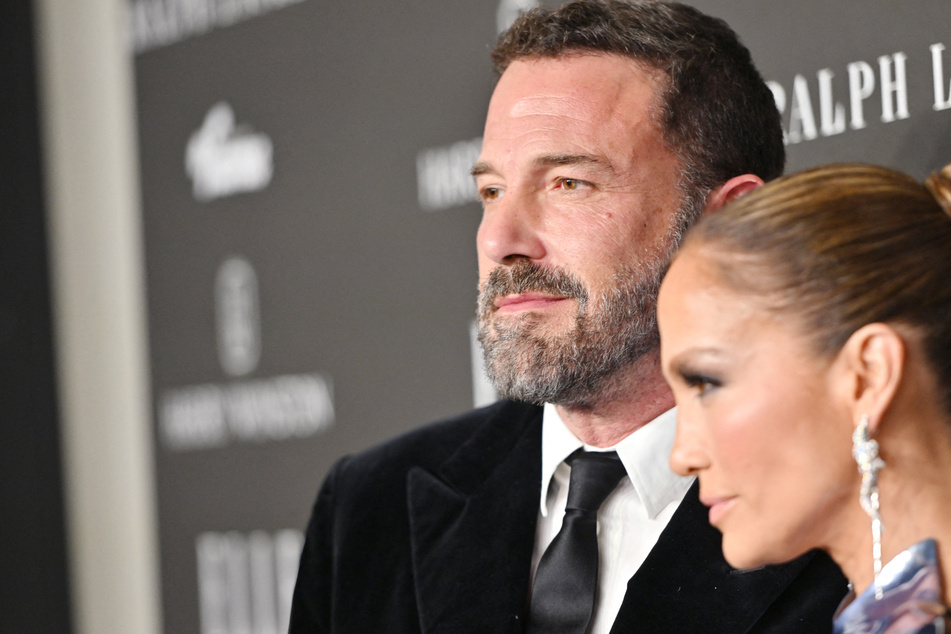Ben Affleck (l.) scolded paparazzi who hounded the actor as he exited the home he shares with his wife, Jennifer Lopez, on Sunday.