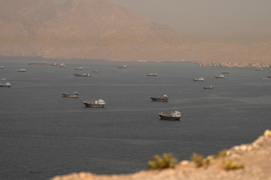 Vessels are pictured in the Strait of Hormuz, as seen from Musandam, Oman, on June 18, 2026.