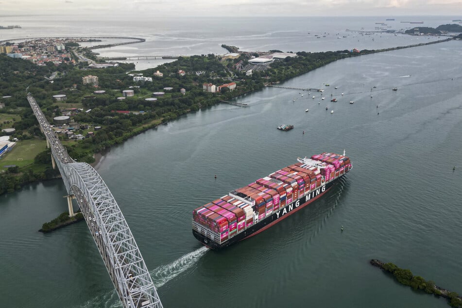 The Taiwanese cargo ship Yang Ming sails out of the Panama Canal on the Pacific side in Panama City on October 6, 2025.