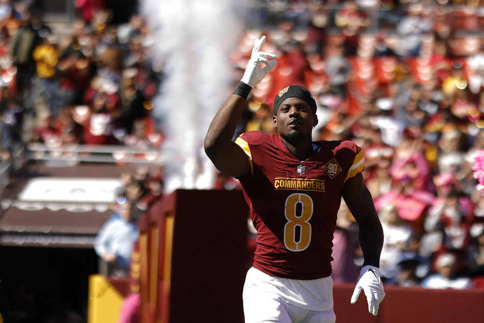Brian Robinson Jr. entering the field during the Washington Commanders' game against the Tennessee Titans.