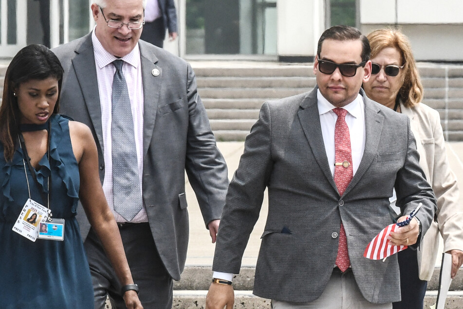 George Santos greeted by angry protesters as thousands of documents turned over to legal team