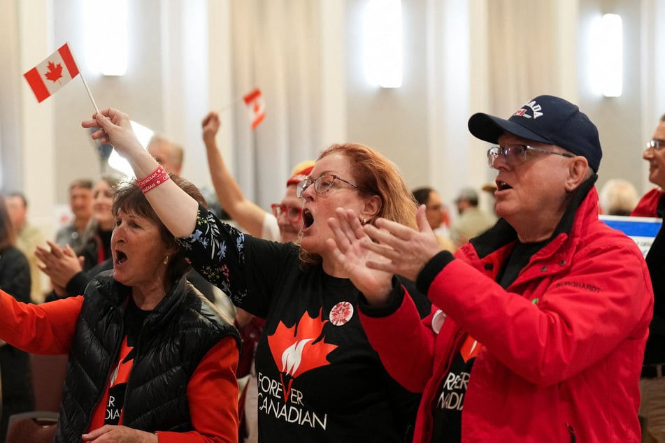 Supporters of the Forever Canadian group react after Alberta residents voted to remain part of Canada in a non-binding referendum, in Edmonton, Canada, on October 19, 2026.
