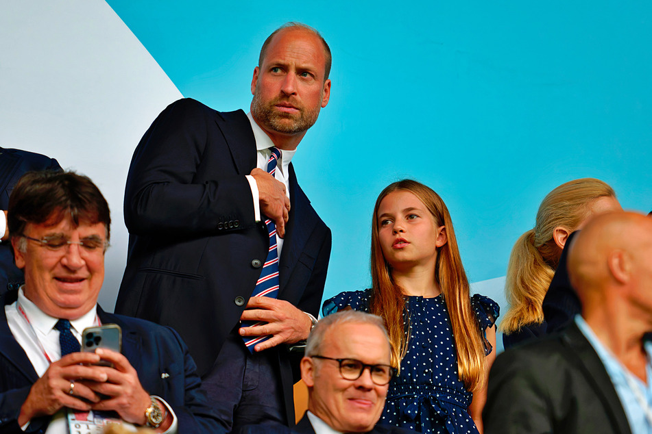 Last year, Prince William (center l.) took his daughter Charlotte (center r.) to a soccer game at the European Women's Championship.
