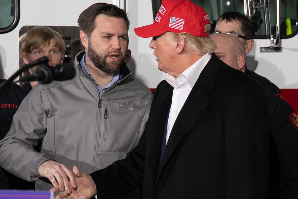 JD Vance (L) shaking hands with Donald Trump (r.) during an event at the East Palestine Fire Department in East Palestine, Ohio, on February 22, 2023.