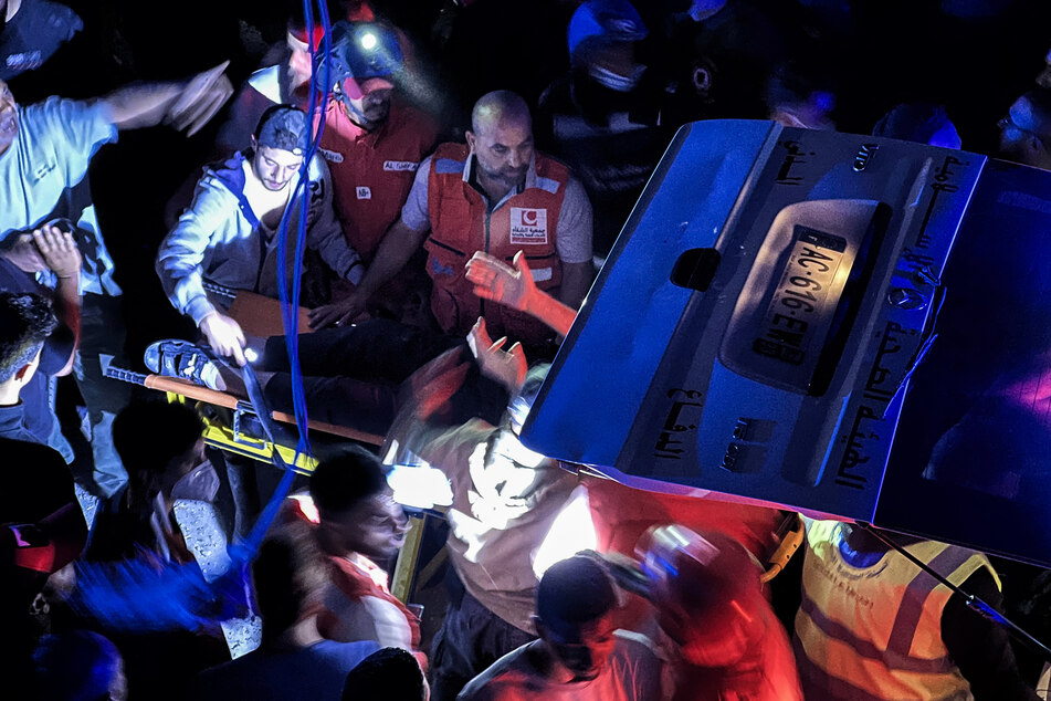 First responders evacuate a person from the site of an Israeli strike in Sidon, southern Lebanon, on May 28, 2026.