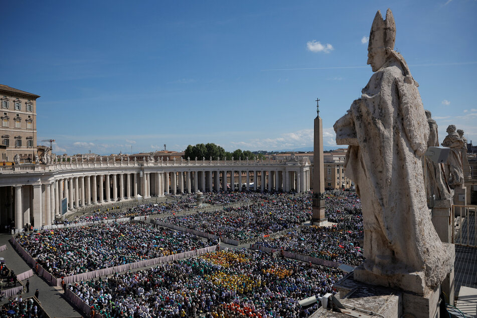 People attend a mass for the Vatican workers, following the funeral for Pope Francis, in St. Peter's Square on April 27, 2025.