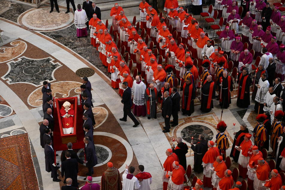 The body of Pope Francis arrives in St. Peter's Basilica for three days of lying in state on April 23, 2025.