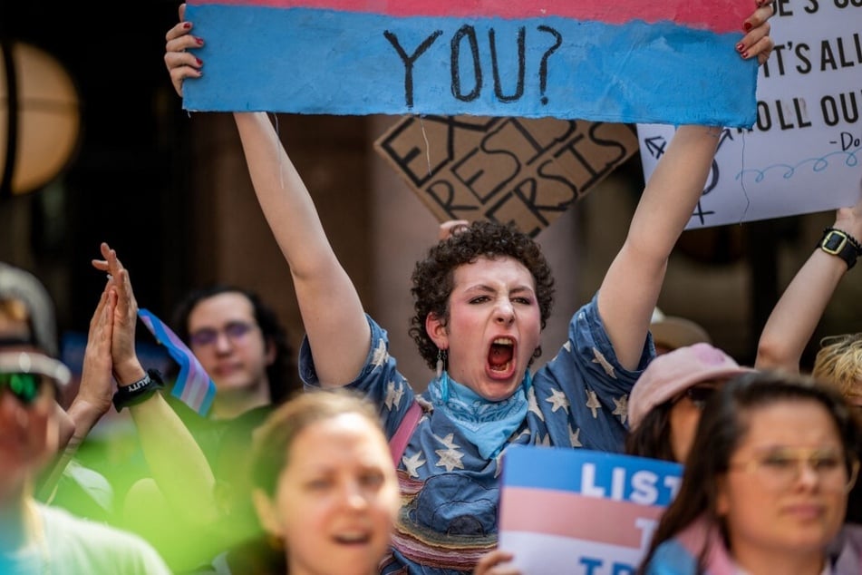 Texans rally outside the State Capitol in Austin to protest Republicans' anti-trans agenda.