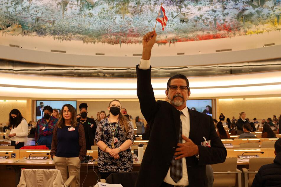 Human rights advocates turn their backs on US officials in silent protest at United Nations