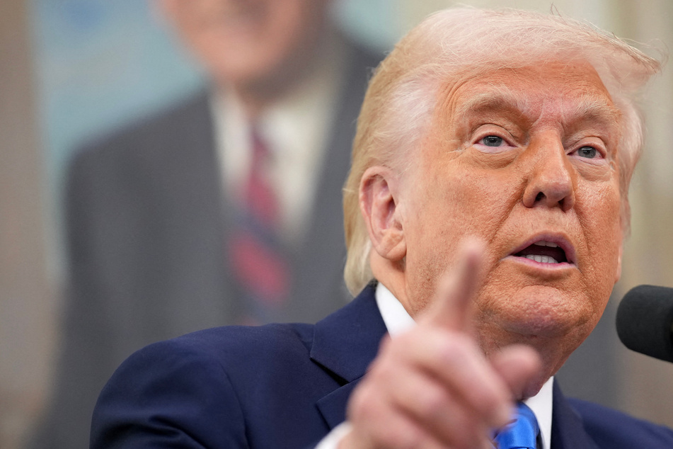 President Donald Trump signed an executive order on Thursday placing restrictions on the former law firm of the prosecutor who investigated suspected Russian ties during his first term.
