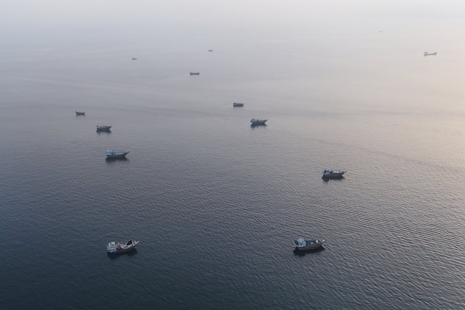 Boats are pictured anchored off Oman’s northern Musandam Peninsula near the Strait of Hormuz on June 27, 2026.