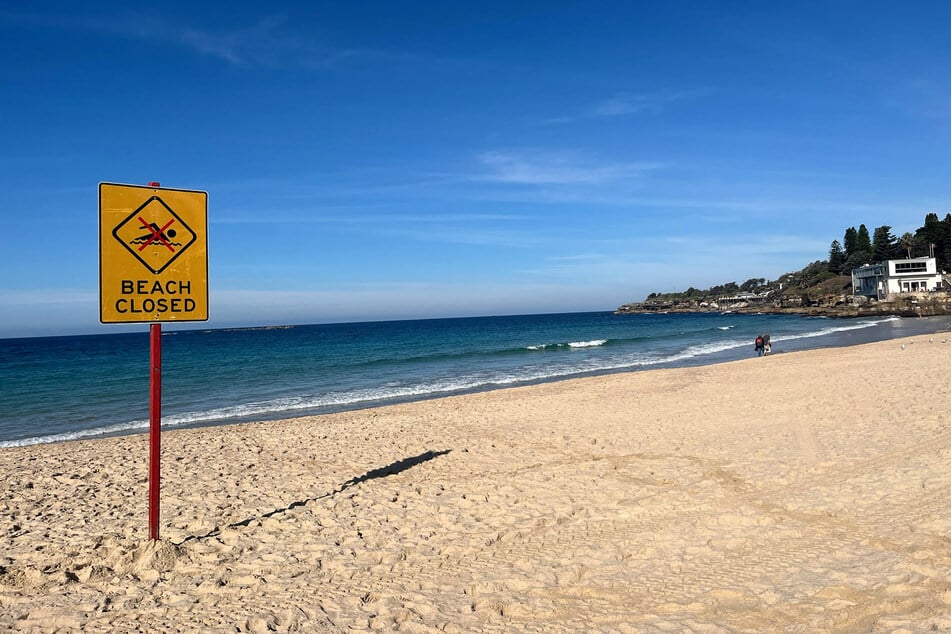 A beach closed sign is displayed at Coogee Beach in Sydney, Australia, on June 13, 2026.