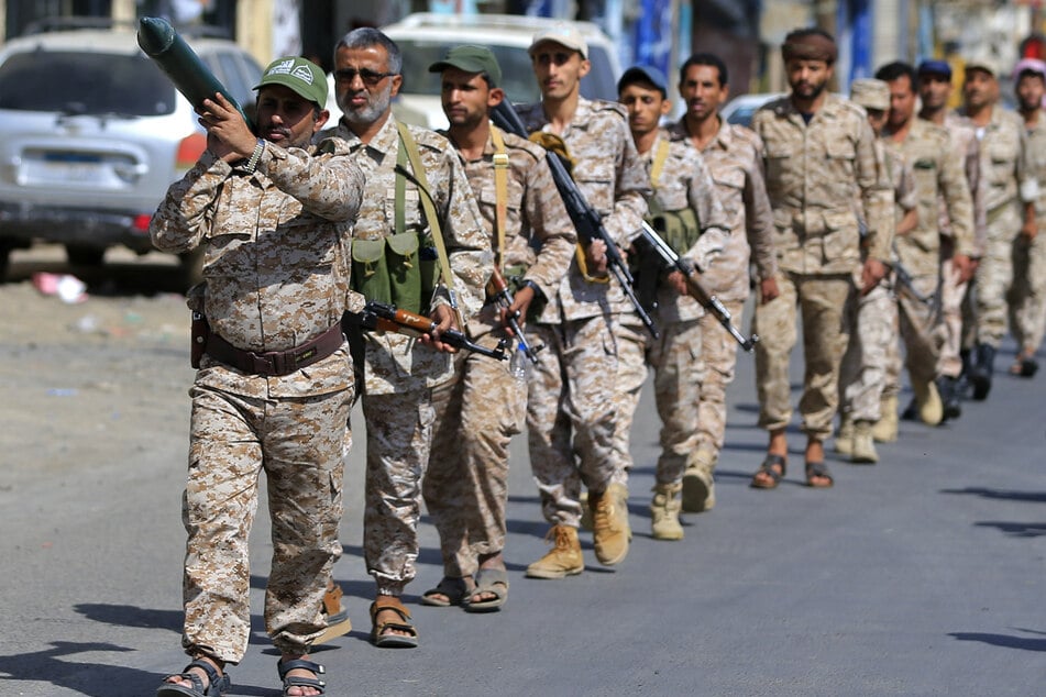 Houthi soldiers march during a rally to recruit more fighters in Sanaa on September 10. The rebel group is now threatening attacks against US assets in the Middle East.