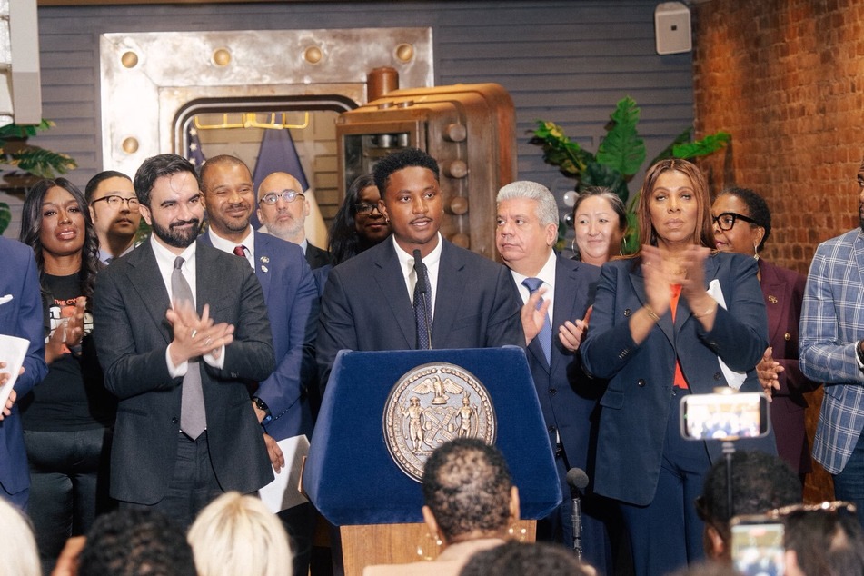 New York City Councilmember Chi Ossé (c.) speaks at a press conference alongside Mayor Zohran Mamdani (l.) announcing the establishment of the Mayor's Office of Deed Theft Prevention on April 24, 2026.