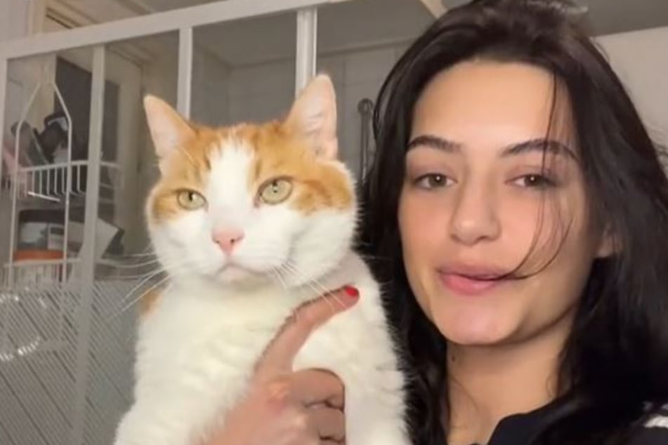 Dominique and her cat Willem.