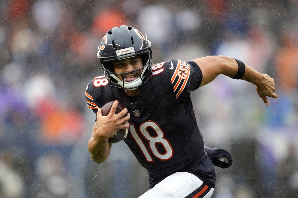 Caleb Williams of the Chicago Bears scrambles with the ball against the Minnesota Vikings during the third quarter at Soldier Field on September 20, 2026. He got a "somewhat encouraging" medical report after suffering a hamstring injury during the game.