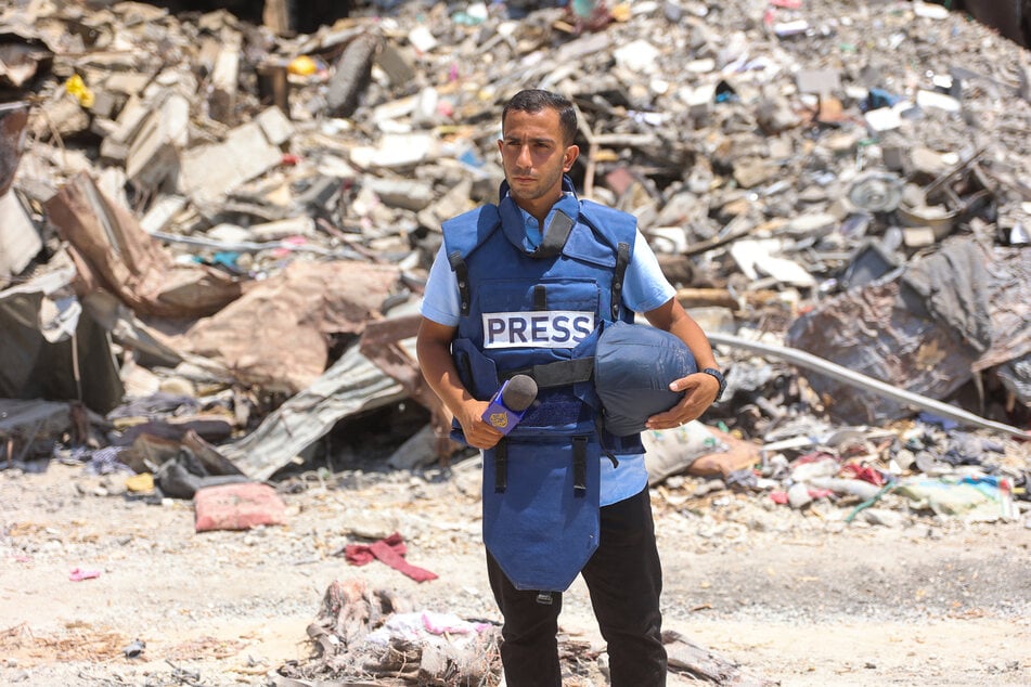 Al-Jazeera correspondent Anas Al-Sharif reports near the Arab Ahli (Baptist) Hospital in Gaza City on October 10, 2024.