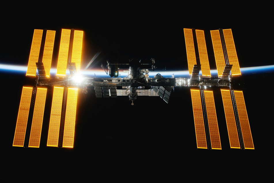 NASA has given the all clear after astronauts briefly sheltered in a docked capsule due to a leak.