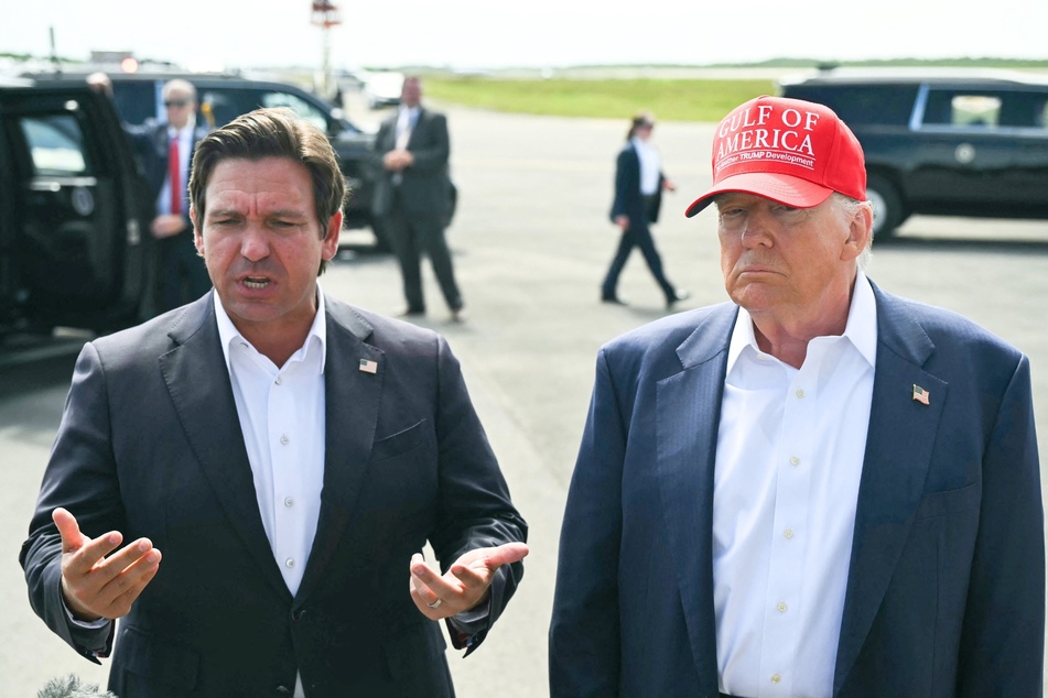 President Donald Trump (r.) joined Florida Governor Ron DeSantis for the opening of a new migrant detention center on Tuesday.