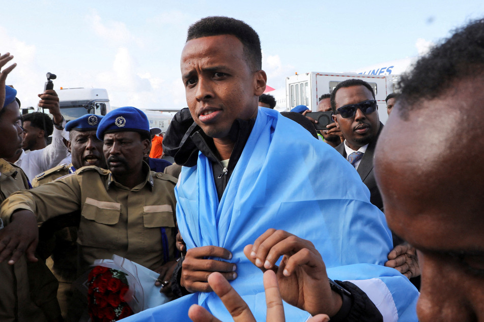 Somali referee Omar Abdulkadir Artan is received as he arrives at the Aden Abdulle Osman International Airport in Mogadishu on June 10, 2026.