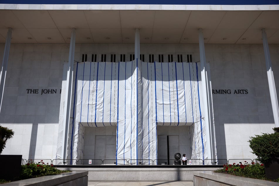 A tarp remains in place on the facade of the John F. Kennedy Center for the Performing Arts in Washington DC on August 25, 2026.